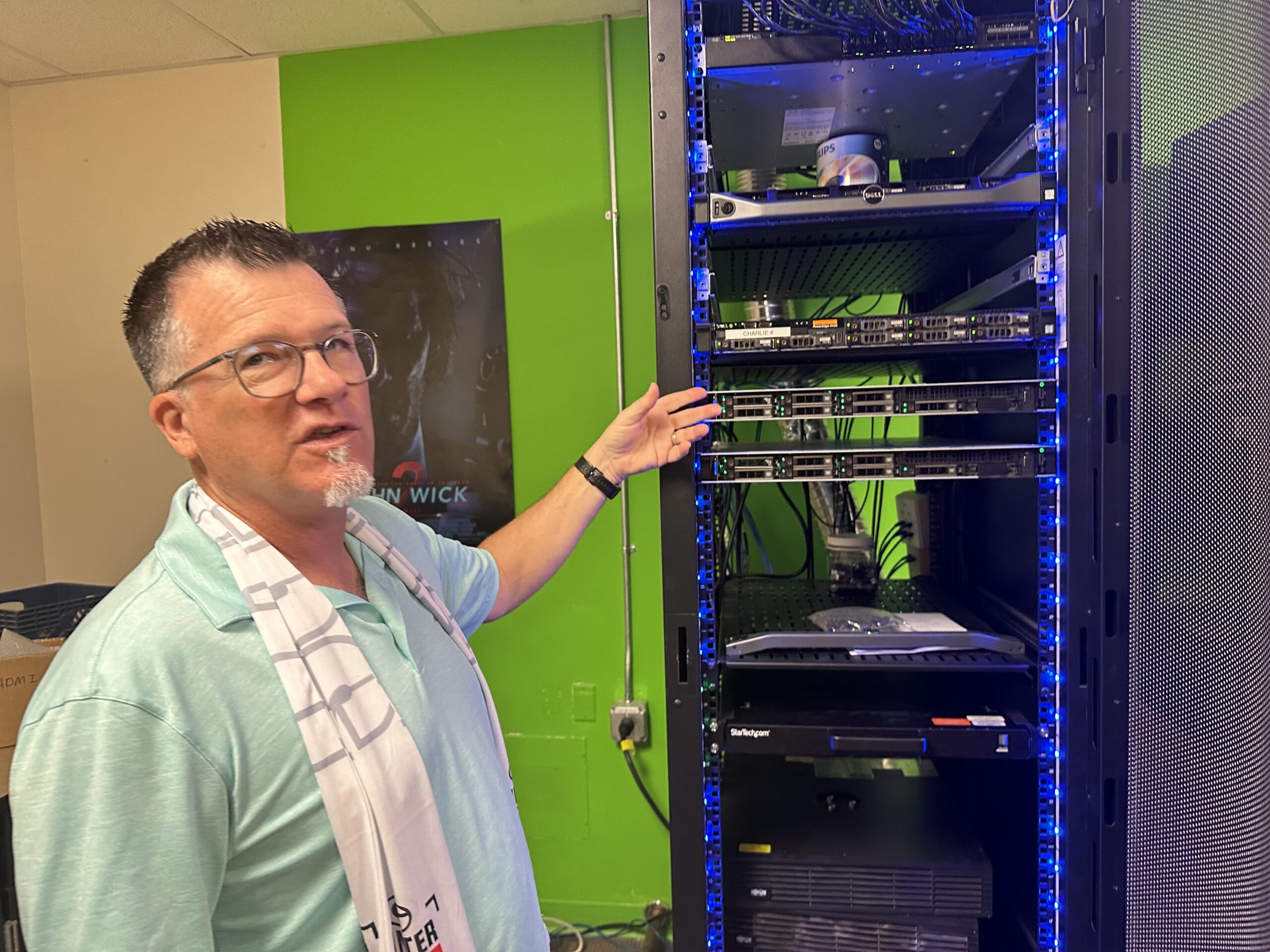 Longtime MHS teacher Brad Chamberlain shows a server designed by students for 24PinTech. [Jeff Chew]