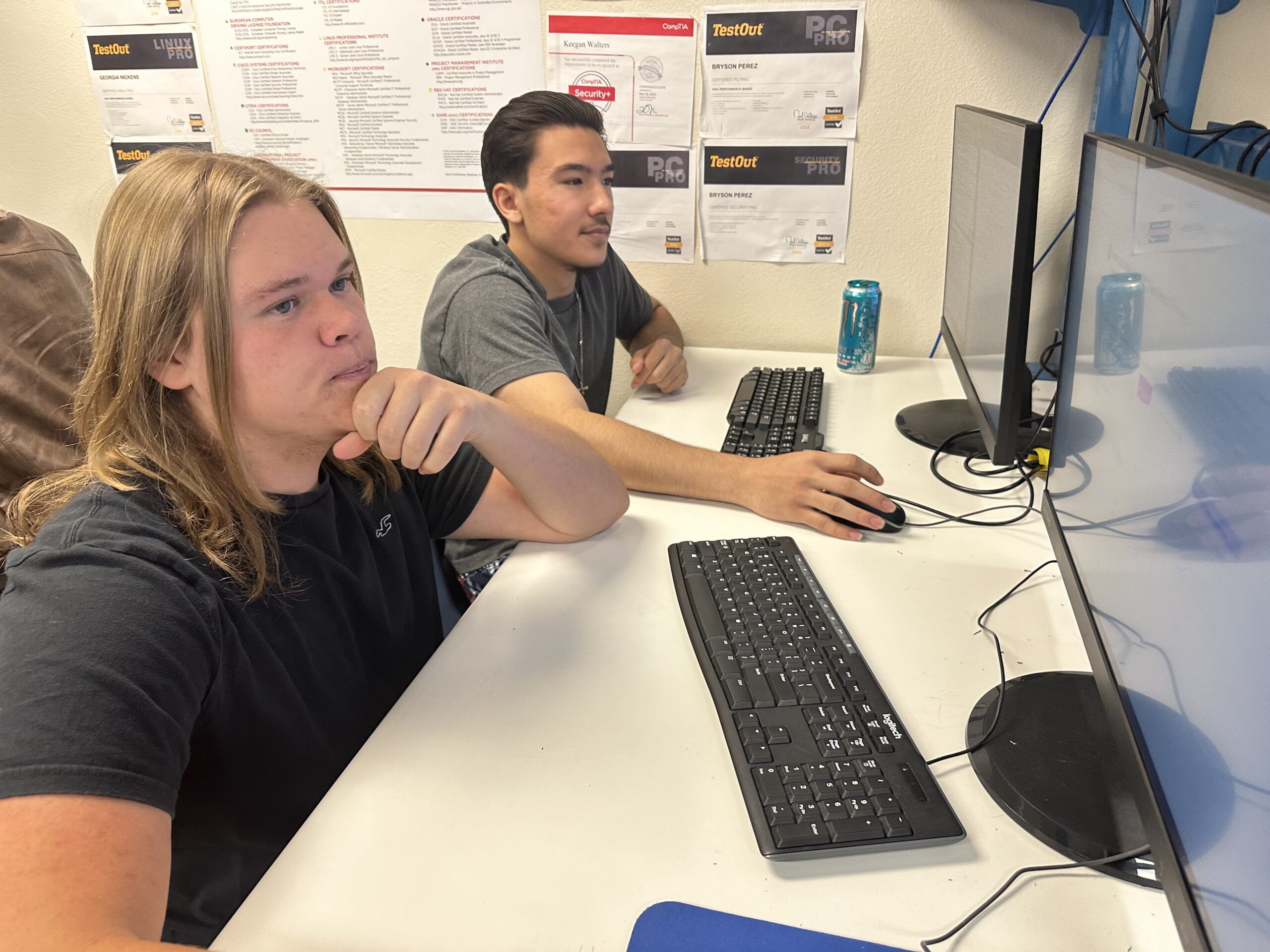 MHS students Asher Hyde, left, and Evan Addington, repair and manage projects for 24PinTech. [Jeff Chew]