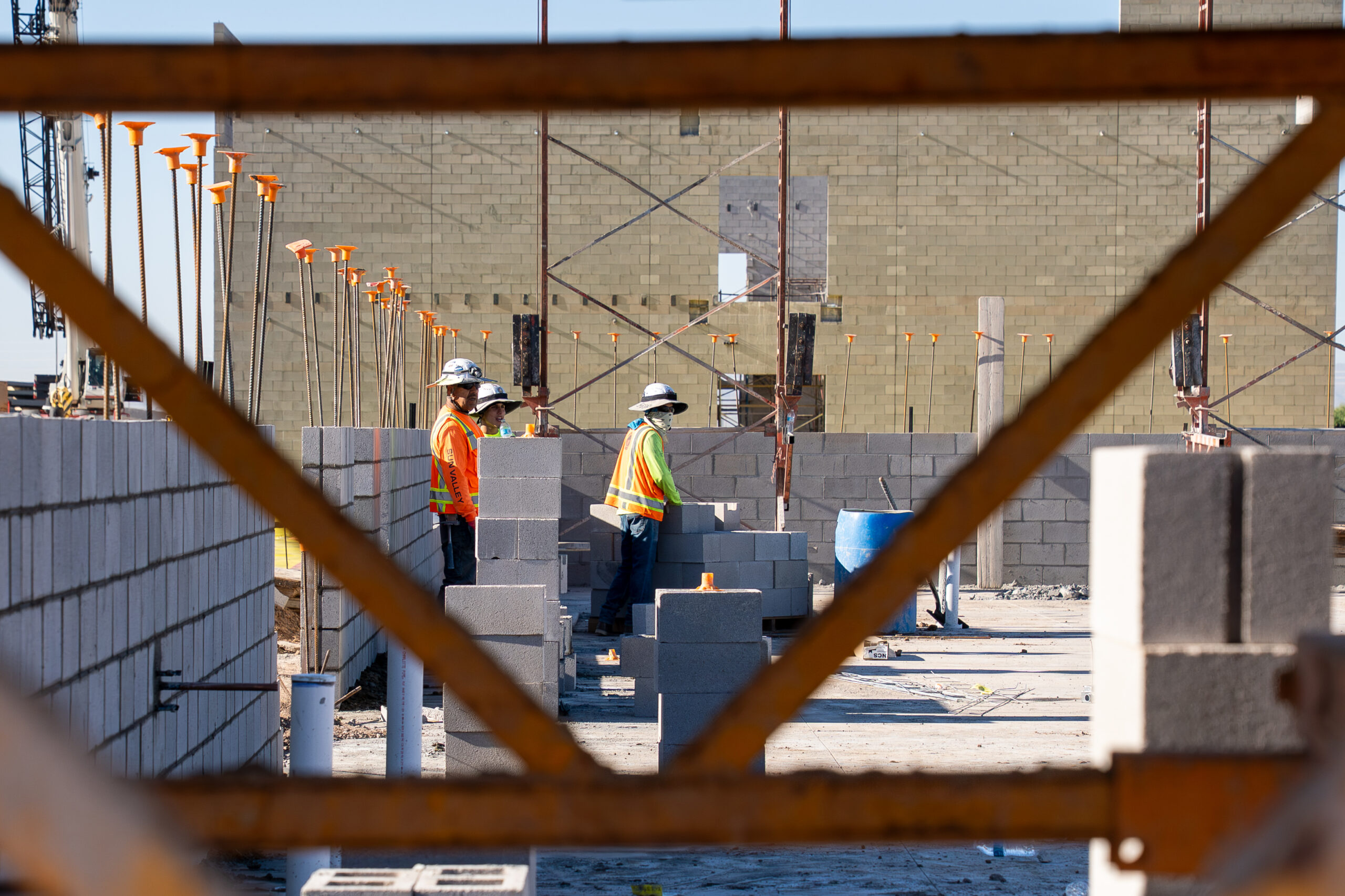 MUSD officials lay ceremonial bricks at the Sorrento K-8 cornerstone event as crews from Chasse Building Team continue foundation work. Oct. 29, 2025. [David Iversen]