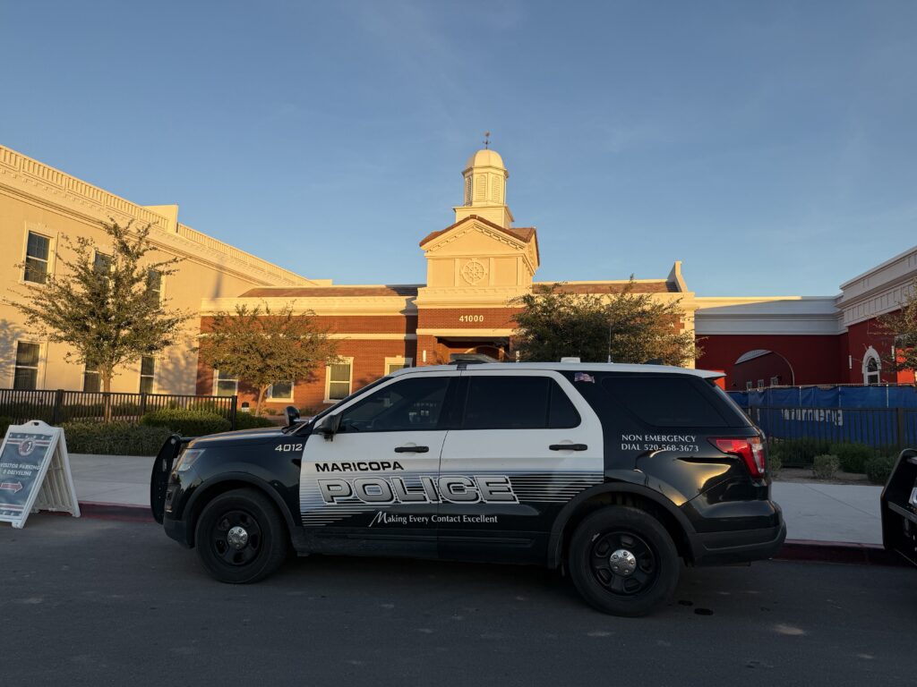 Maricopa police sit in front of Heritage Academy on Dec. 17, 2025. [David Iversen]