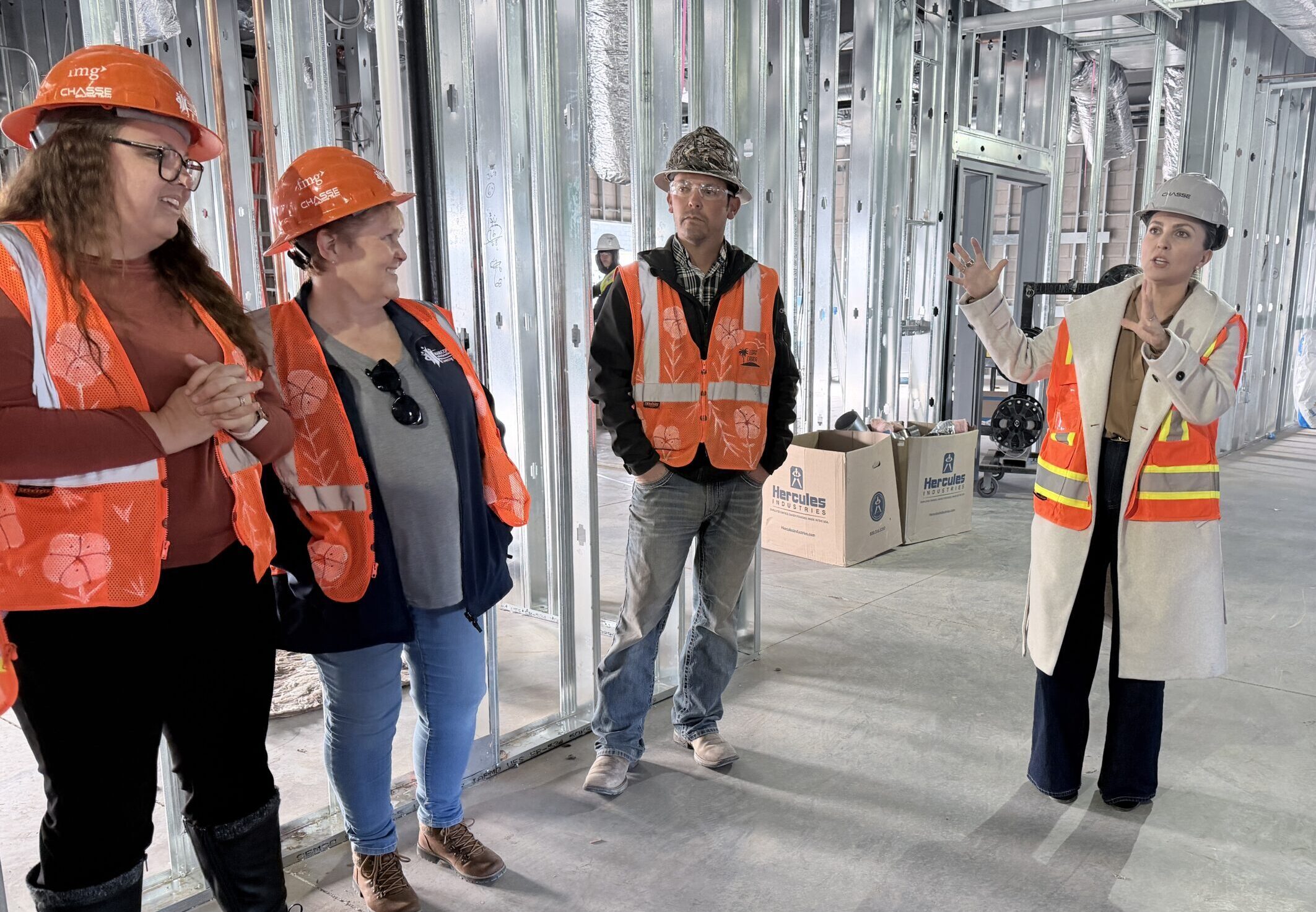 Grace Design partner explaining the design of the classrooms to better accommodate team teaching