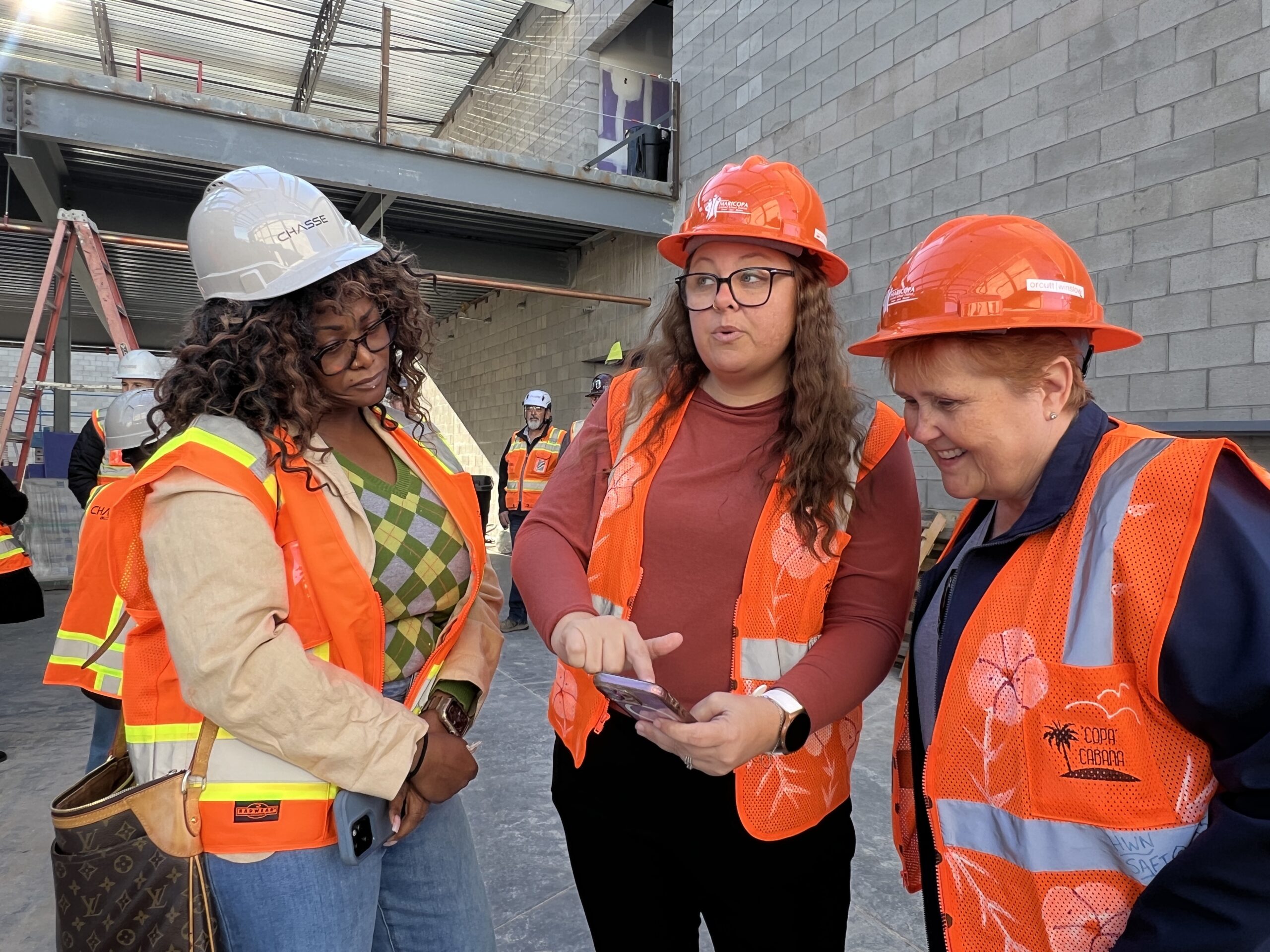 Principal Allison showing President Coutre and member Rothschild the layout for the AFIA