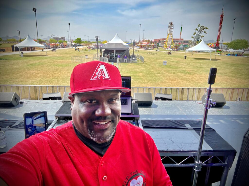 Demetrius Seabrooks, AKA DJ Spin, stands on the main stage while he sets up to be the opening act for Wild West Music Fest on March 29, 2026. [Submitted]