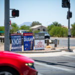 A trio of campaign signs sit on the southeastern corner of John Wayne Parkway and Bowlin Road on May 21, 2026. [Monica D. Spencer]