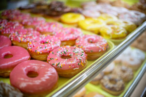 A tray of donuts sit behind the counter at Blooming Donuts on June 6, 2026. [Monica D. Spencer]