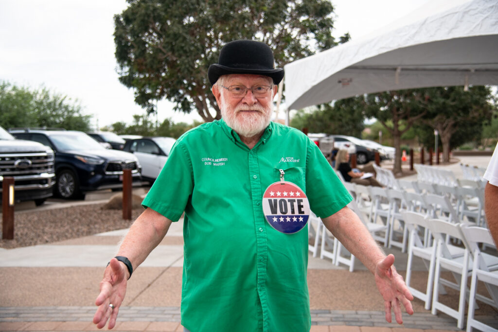 Councilmember Bob Marsh wears a large voting button during a ribbon cutting ceremony on Oct. 10, 2026. [Monica D. Spencer]