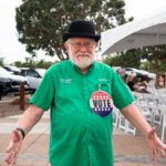 Councilmember Bob Marsh wears a large voting button during a ribbon cutting ceremony on Oct. 10, 2026. [Monica D. Spencer]