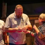 Veterans in Need Board Member Justin Price accepts a donation check from Maricopa Moose and Duke's Roadhouse on Oct. 19, 2026. [Monica D. Spencer]
