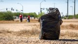 A full trash bag sits in the dirt during the Keep Maricopa Beautiful event at the Maricopa Community Center on May 30, 2026. [Ryan Tafoya]
