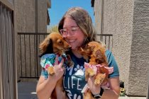Chloe Jordan holds her dachshunds Shades and Canela in this undated photo. [Doxies of the Desert]