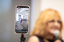 A Facebook livestream broadcasts city council candidate Tena Dugan at InMaricopa's city council candidate forum at Maricopa Library and Cultural Center on June 25, 2026. [Ryan Tafoya]