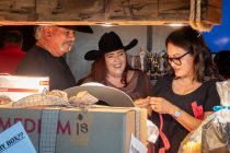 Guests laugh during the Dirty Boots & Dollars Fundraiser at Duke's Roadhouse on June 27, 2026. [Ryan Tafoya]