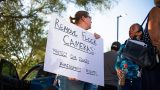 Amber Rutan holds a sign that reads "Remove Flock cameras: Protect our fourth amendment rights" during a protest outside Maricopa City Hall on Sept. 1, 2026. [Monica D. Spencer]