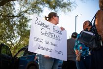 Amber Rutan holds a sign that reads "Remove Flock cameras: Protect our fourth amendment rights" during a protest outside Maricopa City Hall on Sept. 1, 2026. [Monica D. Spencer]