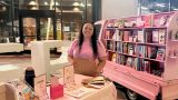 Owner Elicia Gabriela Estrada next to Graciela's Mobile Books. [Submitted]