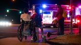 Pedestrians on John Wayne Parkway and Edison Road watch as Maricopa Fire and Police investigate a crash involving a pedestrian on Sept. 18, 2026. [Monica D. Spencer]
