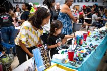 Janelle Gomez watches 4-year-old Anela paint rocks during Kids Day Maricopa at Maricopa Wells Middle School on Sept. 19, 2026. [Monica D. Spencer]