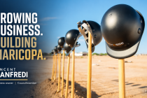 Black construction helmets resting on gold shovels beside the words “Growing business. Building Maricopa.” and Vincent Manfredi’s name.